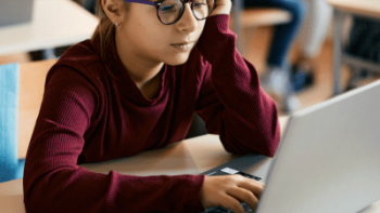Child looking at laptop